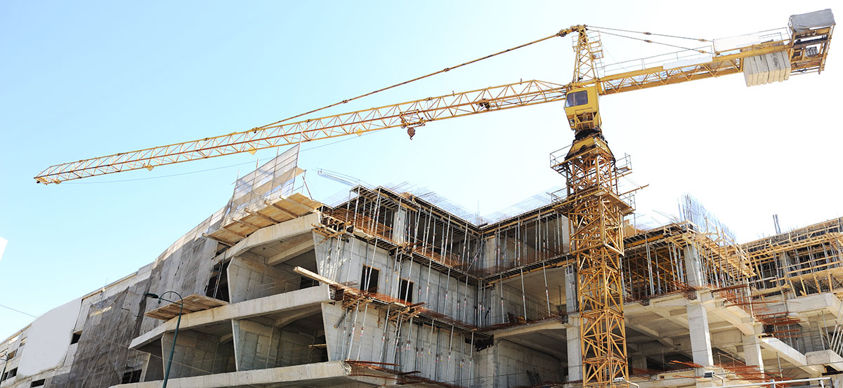 Crane and house under construction